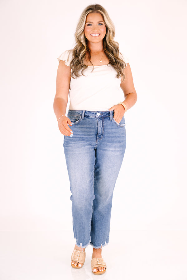Chic Soul plus size clothing, medium wash ankle jeans with relaxed fit and distressed raw hem