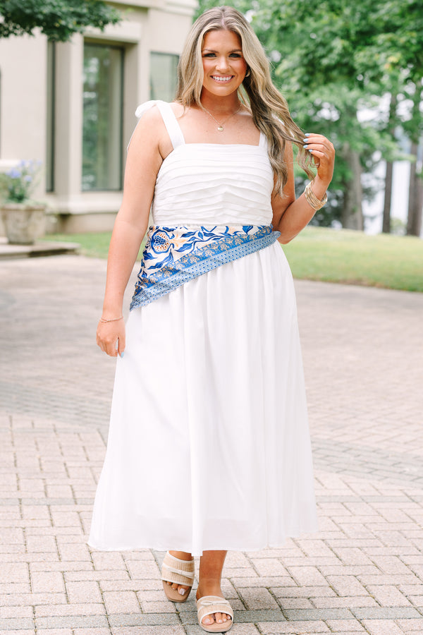 Plus Size white midi dress with a pleated bodice, tie-shoulder straps, and a blue patterned sash.