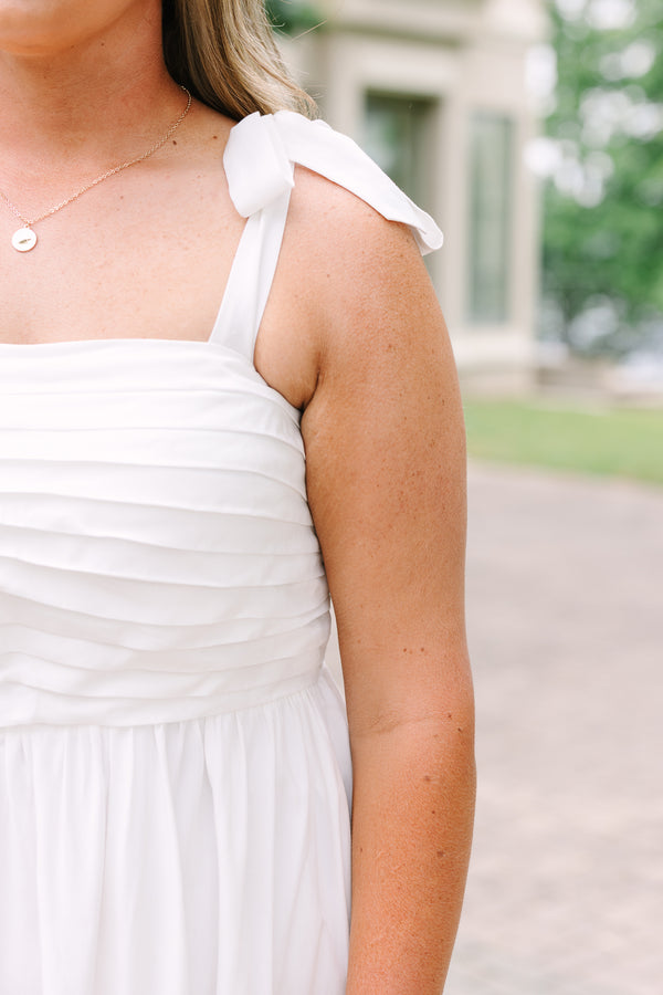 Plus Size white midi dress with a pleated bodice, tie-shoulder straps, and a blue patterned sash.