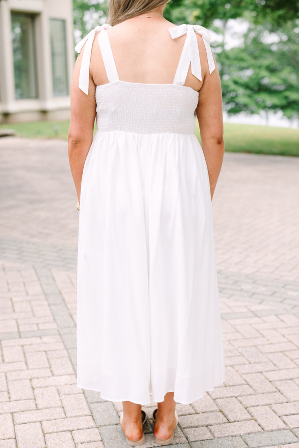 Plus Size white midi dress with a pleated bodice, tie-shoulder straps, and a blue patterned sash.