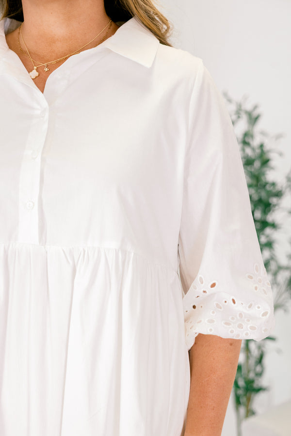 Chic Soul plus size clothing, White midid dress with buttons going down to the bottom of the chest and a collar of the neckline as well as eyelet details at the end of the sleeves and bottom of the dress 
