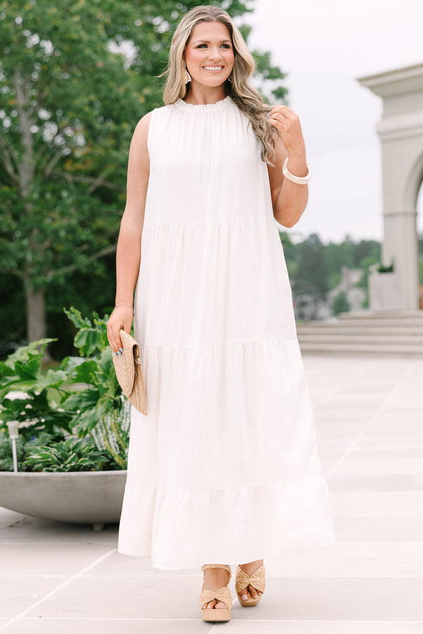 Chic Soul Plus Size Clothing, an oatmeal maxi-dress with four tiers and a ruffle detail at the collar and bow at back neck