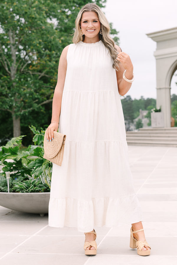 Chic Soul Plus Size Clothing, an oatmeal maxi-dress with four tiers and a ruffle detail at the collar and bow at back neck