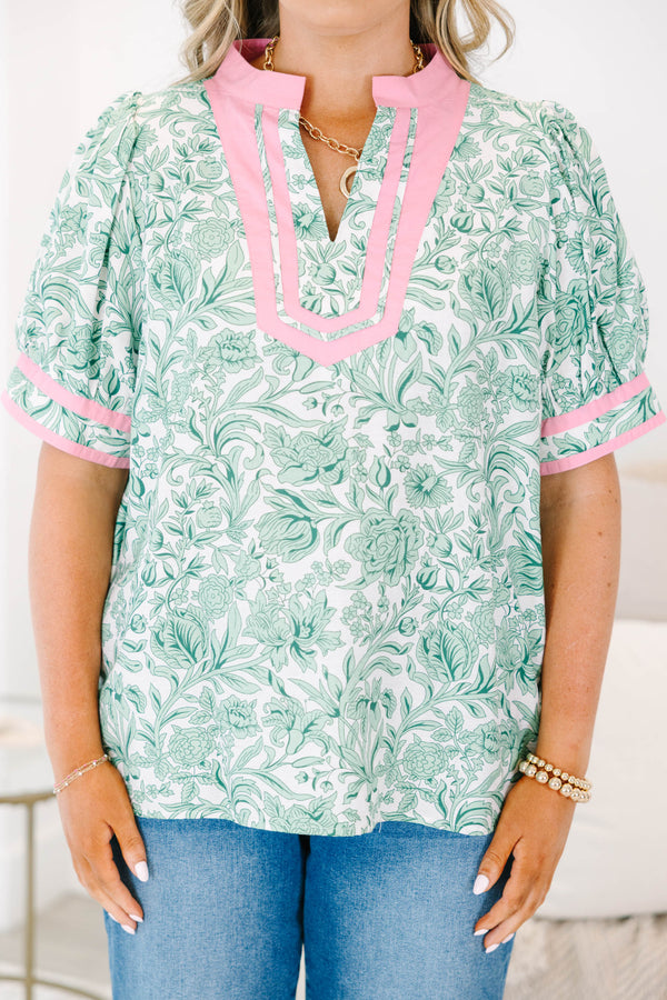 Plus Size green and white floral print top with pink trim, split neckline, and puff sleeves.