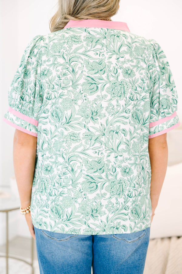Plus Size green and white floral print top with pink trim, split neckline, and puff sleeves.