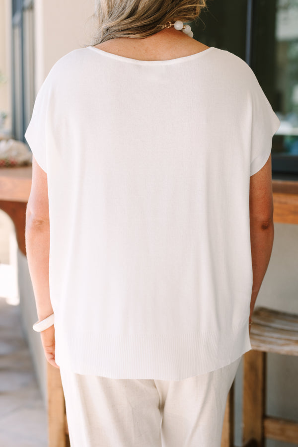 Short sleeve v-neck sweater in off-white with a relaxed fit and textured knit fabric.