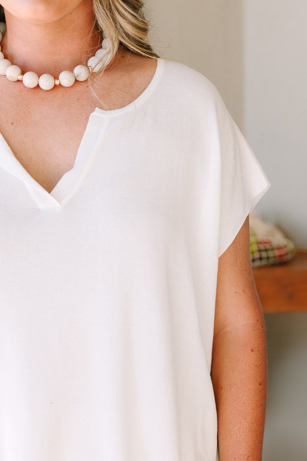 Short sleeve v-neck sweater in off-white with a relaxed fit and textured knit fabric.