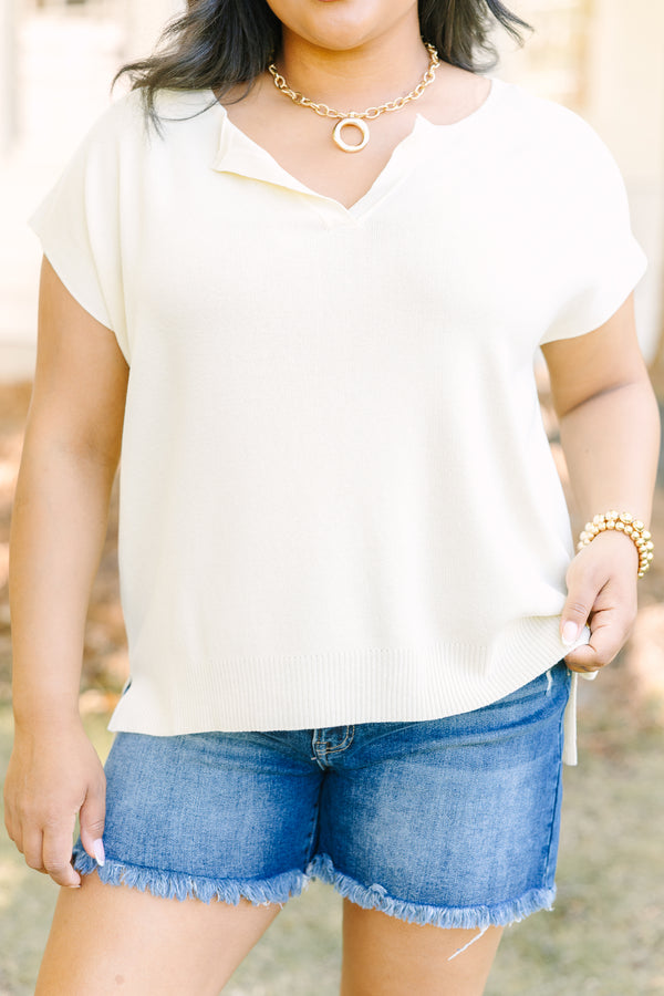 Plus Size short sleeve yellow V-neck sweater with a relaxed fit and side slits.