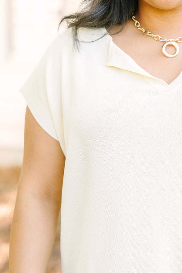 Plus Size short sleeve yellow V-neck sweater with a relaxed fit and side slits.