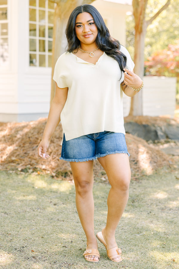 Plus Size short sleeve yellow V-neck sweater with a relaxed fit and side slits.
