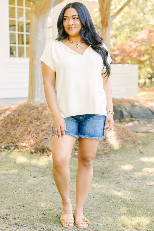 Plus Size short sleeve yellow V-neck sweater with a relaxed fit and side slits.