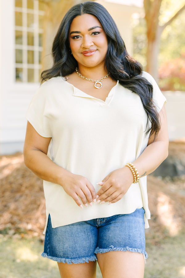Plus Size short sleeve yellow V-neck sweater with a relaxed fit and side slits.
