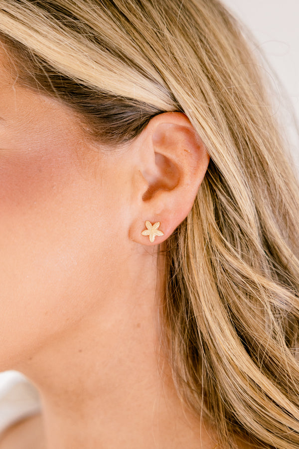 Chic Soul plus size clothing, gold stud earrings that are in a starfish shape 
