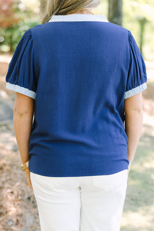 Chic Soul plus size clothing, navy short puff sleeve top with v neck cutout and light blue trim around the neckline and sleeves
