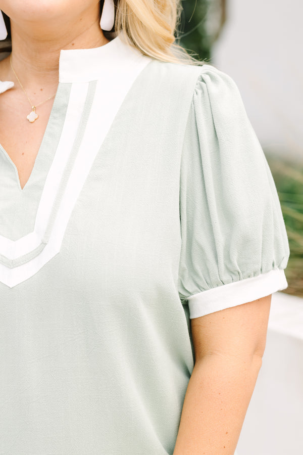 Chic Soul plus size clothing, light green short sleeve top with white detailing around the neckline and sleeves
