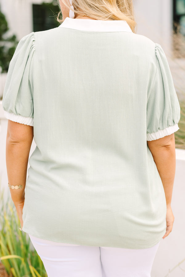 Chic Soul plus size clothing, light green short sleeve top with white detailing around the neckline and sleeves