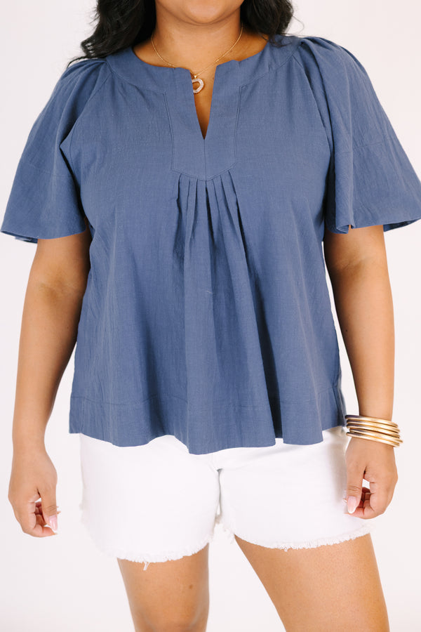Chic soul plus size clothing, navy top with short bell sleeves as well as a v-neckline that has pleats under it 
