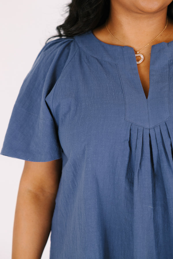 Chic soul plus size clothing, navy top with short bell sleeves as well as a v-neckline that has pleats under it 

