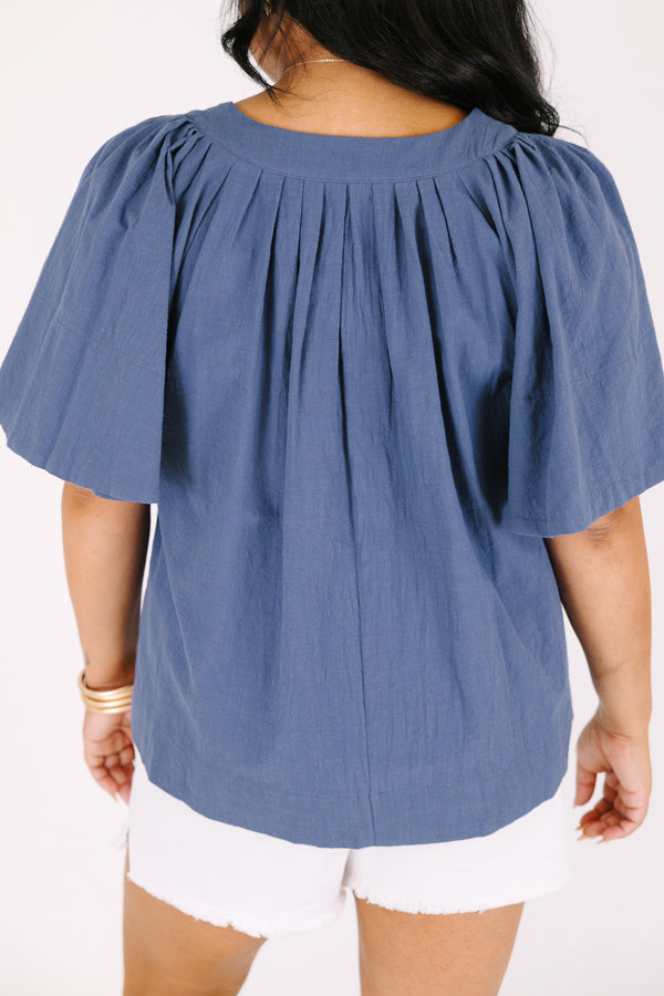 Chic soul plus size clothing, navy top with short bell sleeves as well as a v-neckline that has pleats under it 
