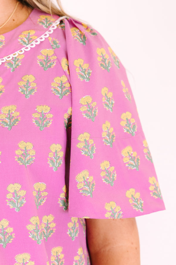 Chic Soul plus size clothing, pink short bell sleeve top with green and yellow floral block pattern and a v neck cutout with piping detailing along the neckline