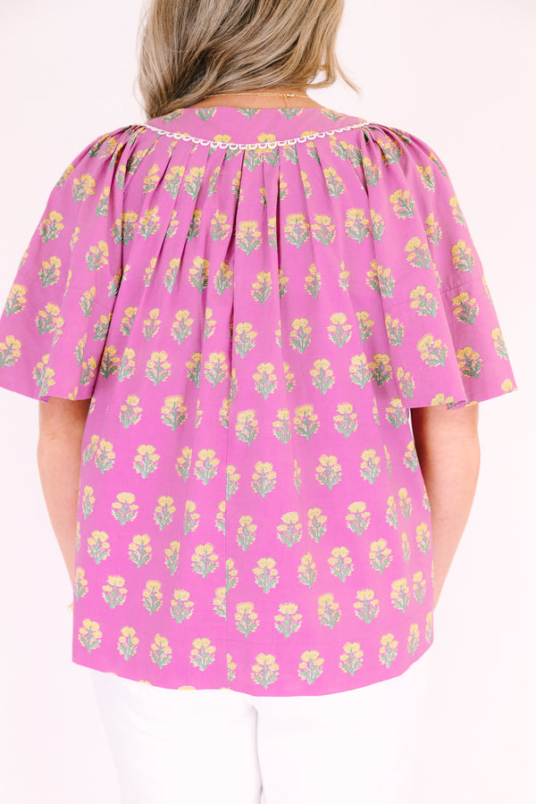 Chic Soul plus size clothing, pink short bell sleeve top with green and yellow floral block pattern and a v neck cutout with piping detailing along the neckline