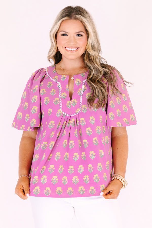 Chic Soul plus size clothing, pink short bell sleeve top with green and yellow floral block pattern and a v neck cutout with piping detailing along the neckline