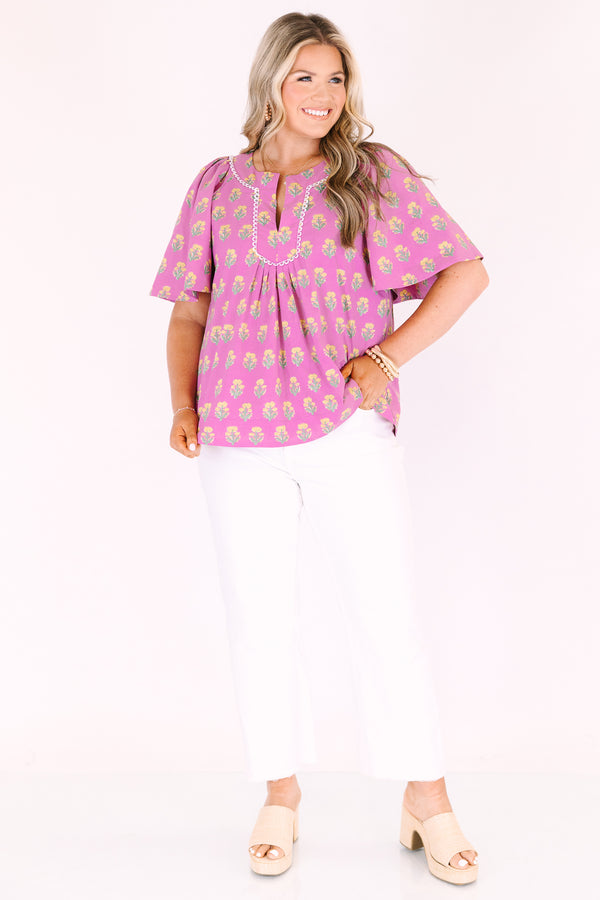 Chic Soul plus size clothing, pink short bell sleeve top with green and yellow floral block pattern and a v neck cutout with piping detailing along the neckline