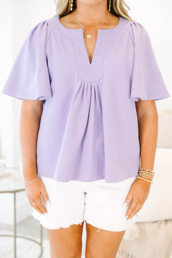 Chic Soul plus size clothing, a top featuring a full hem and butterfly sleeves, there is stitching to highlight the hem on both the shirt and sleeves. the material of the garment is textured 