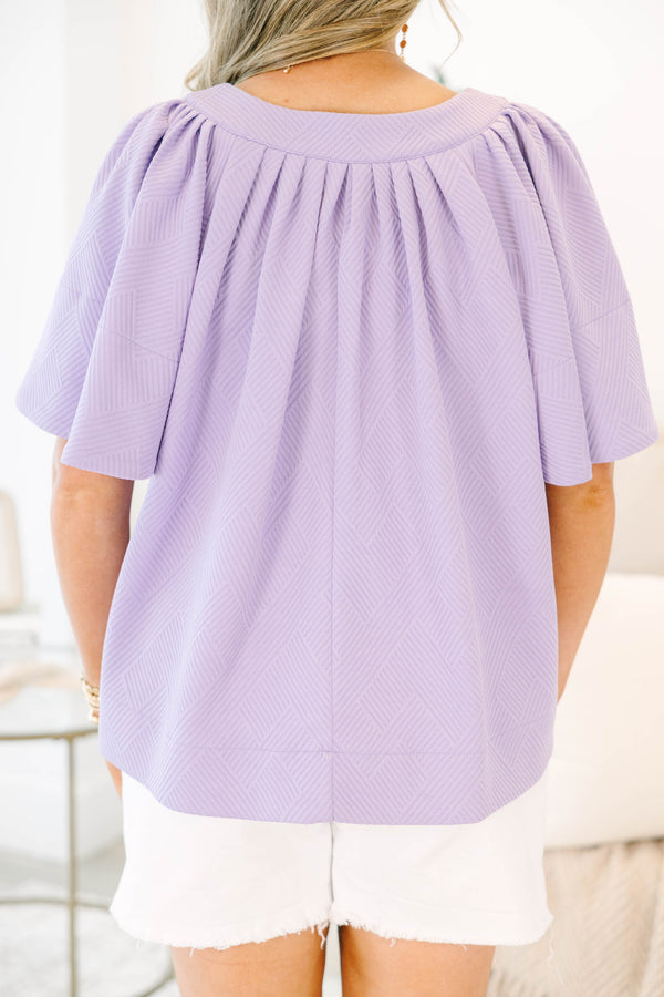 Chic Soul plus size clothing, a top featuring a full hem and butterfly sleeves, there is stitching to highlight the hem on both the shirt and sleeves. the material of the garment is textured 