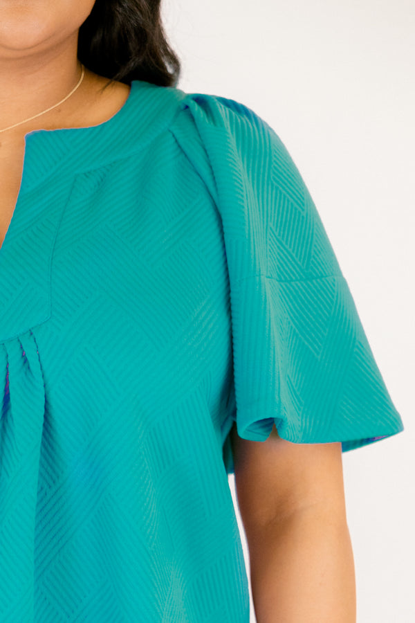 Chic Soul plus size clothing, teal short flowy sleeve top with v-neckline and textured pattern throughout the top