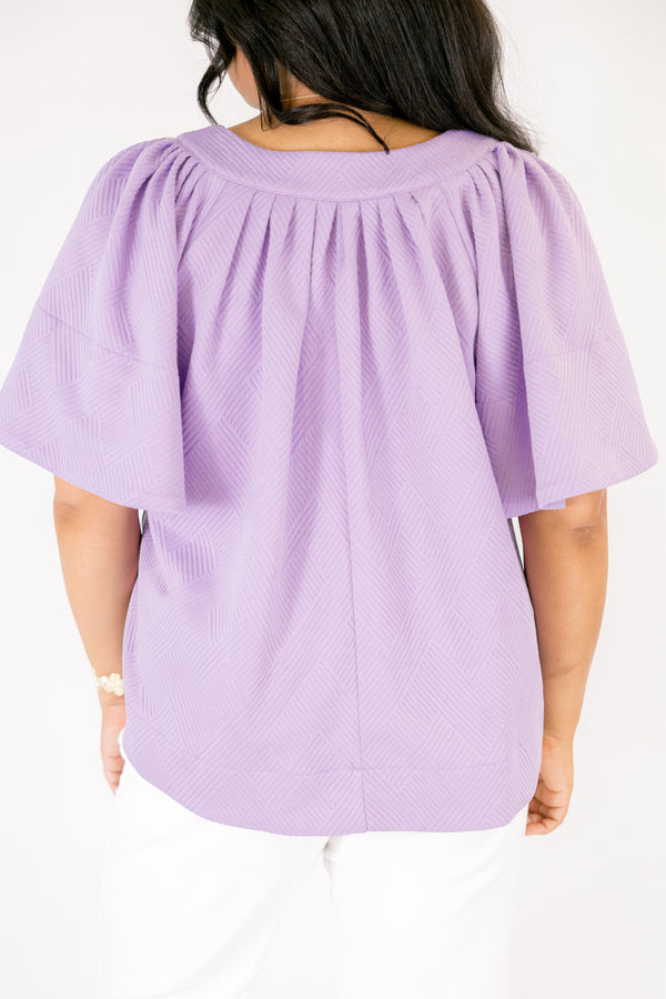 Chic Soul plus size clothing, a top featuring a full hem and butterfly sleeves, there is stitching to highlight the hem on both the shirt and sleeves. the material of the garment is textured 