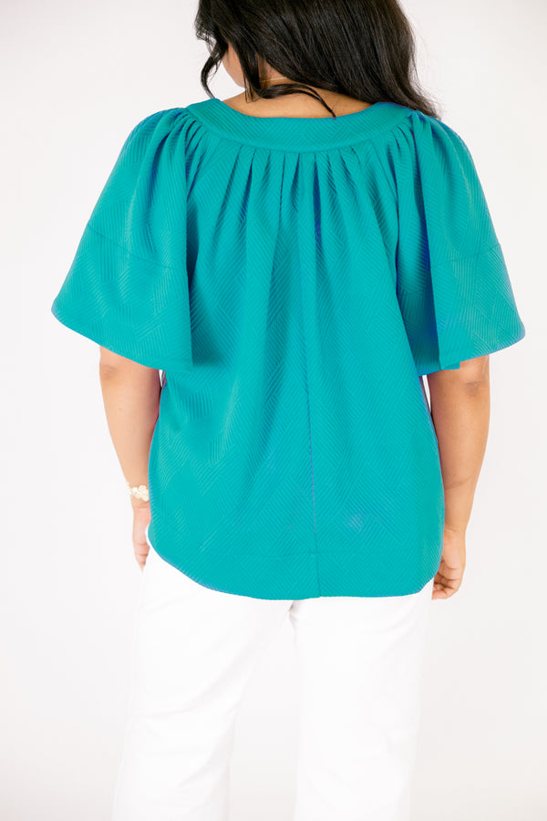 Chic Soul plus size clothing, teal short flowy sleeve top with v-neckline and textured pattern throughout the top