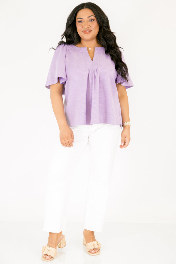 Chic Soul plus size clothing, a top featuring a full hem and butterfly sleeves, there is stitching to highlight the hem on both the shirt and sleeves. the material of the garment is textured 