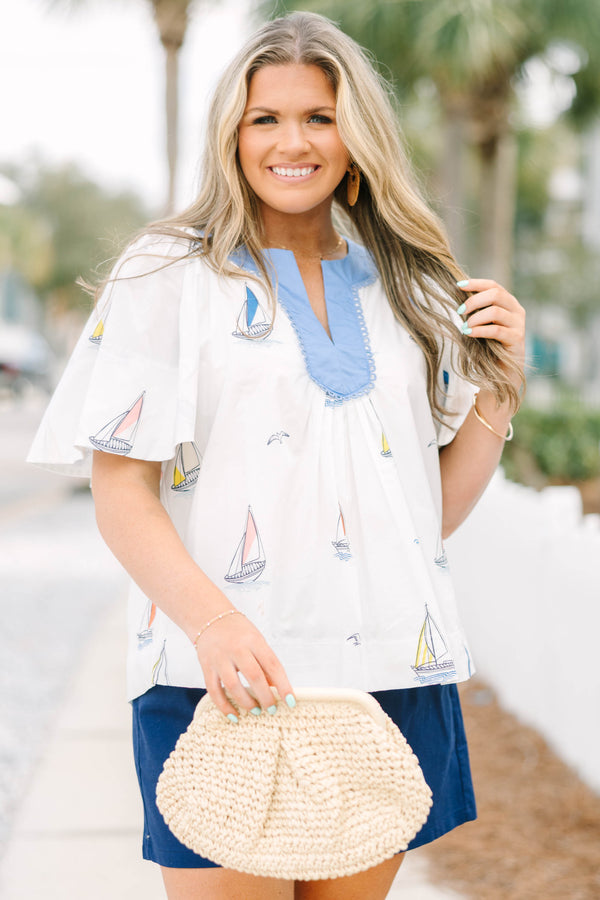 Chic Soul plus size clothing, white short flutter sleeve short sleeve top with v-neckline outlined in blue and small sailboat graphics 