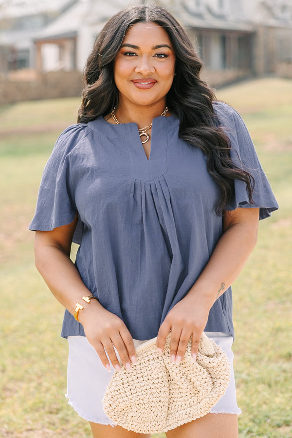 Chic soul plus size clothing, navy top with short bell sleeves as well as a v-neckline that has pleats under it 
