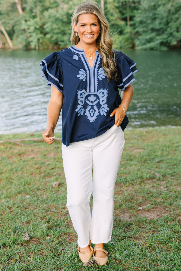 Plus Size navy blue top with light blue embroidery, V-neckline, and tiered flutter sleeves.