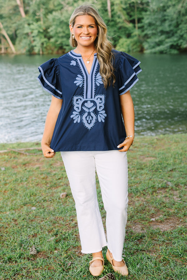 Plus Size navy blue top with light blue embroidery, V-neckline, and tiered flutter sleeves.