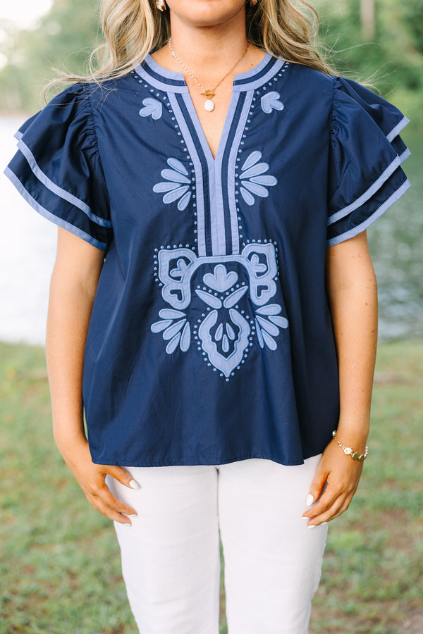 Plus Size navy blue top with light blue embroidery, V-neckline, and tiered flutter sleeves.