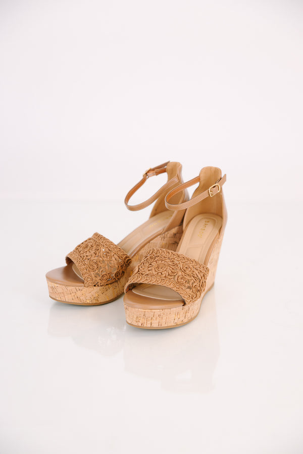 Plus Size tan platform wedges with a crochet strap, cork heel, and adjustable ankle strap.