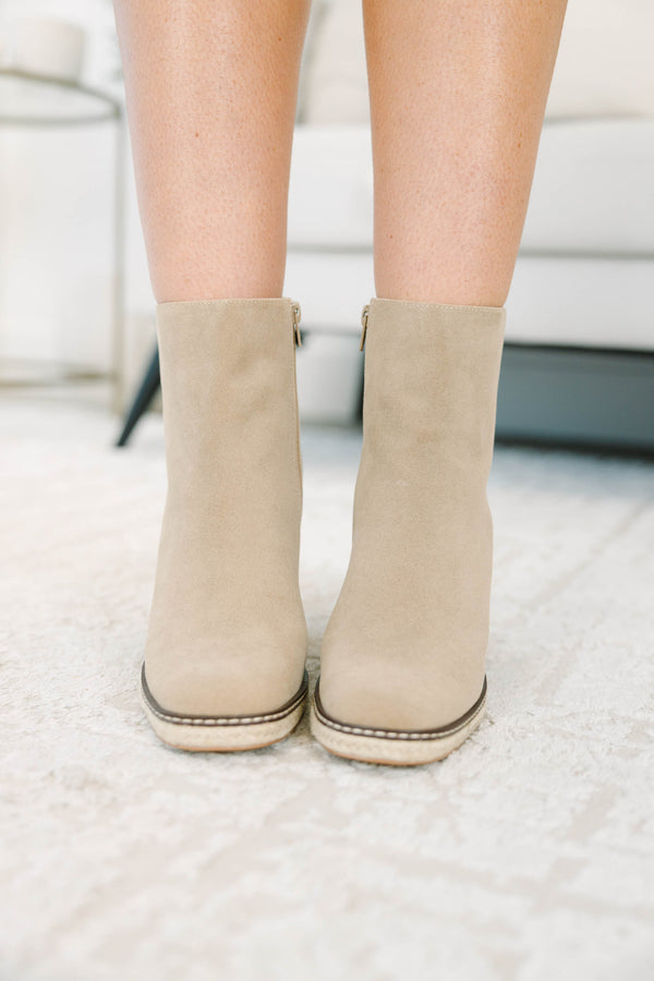 Apricot suede booties with a block heel and braided espadrille trim.