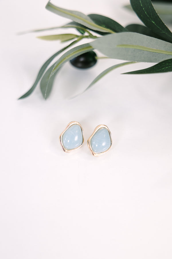 Plus Size irregular gold-rimmed stud earrings with smooth, light blue stone centers.