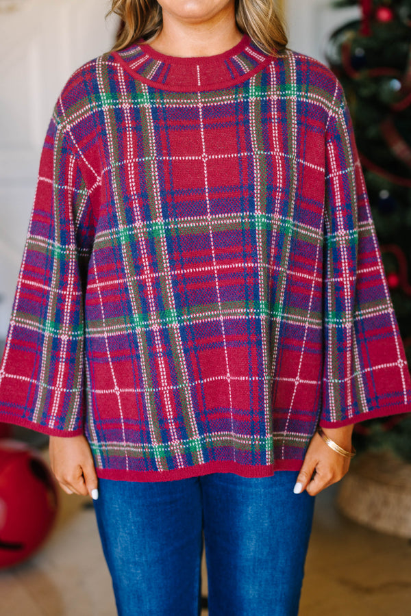 Plus Size red plaid sweater with a crew neckline, long bell sleeves, and a relaxed fit.