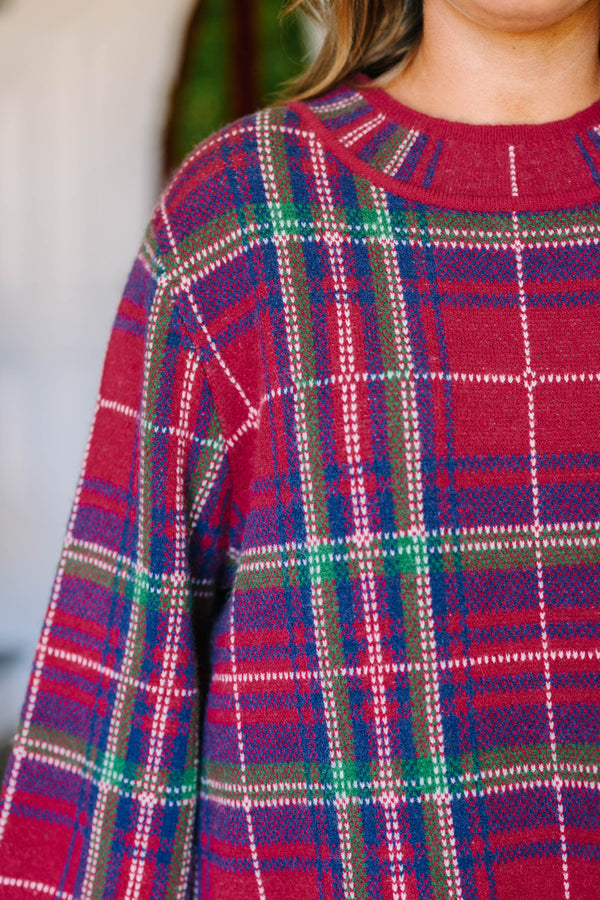 Plus Size red plaid sweater with a crew neckline, long bell sleeves, and a relaxed fit.