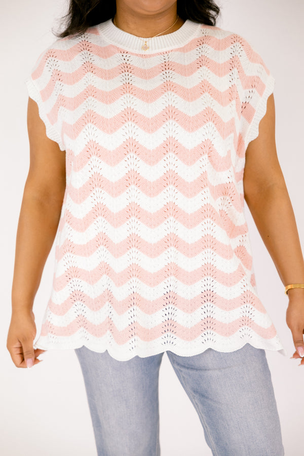 Chic Soul plus size clothing, pink sleeveless sweater with a pink and white wavey striped pattern throughout and the bottom of the sweater is a scalloped hem 