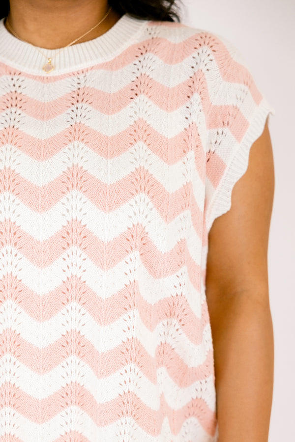 Chic Soul plus size clothing, pink sleeveless sweater with a pink and white wavey striped pattern throughout and the bottom of the sweater is a scalloped hem 