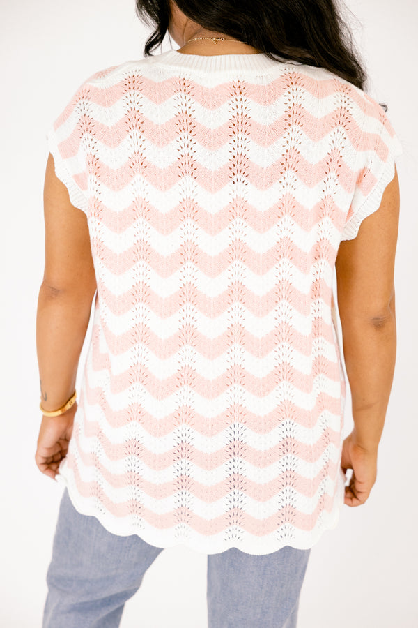 Chic Soul plus size clothing, pink sleeveless sweater with a pink and white wavey striped pattern throughout and the bottom of the sweater is a scalloped hem 