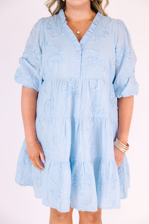 Chic Soul plus size clothing, light blue short puff sleeve tiered baby doll dress with 3 buttons and a v neckline and floral patterned texturing 
