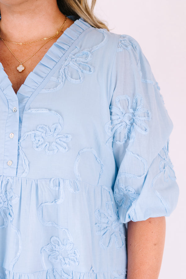 Chic Soul plus size clothing, light blue short puff sleeve tiered baby doll dress with 3 buttons and a v neckline and floral patterned texturing 
