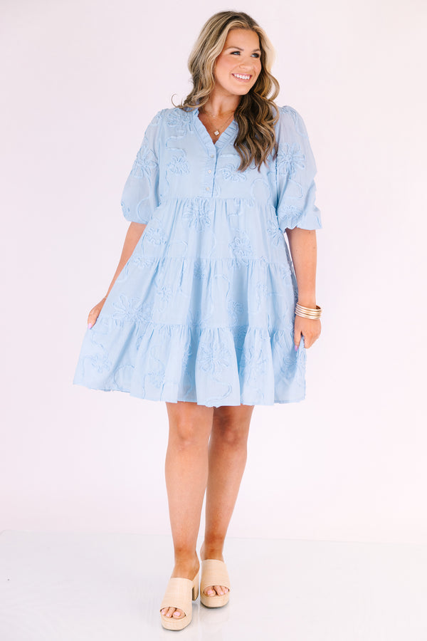 Chic Soul plus size clothing, light blue short puff sleeve tiered baby doll dress with 3 buttons and a v neckline and floral patterned texturing 
