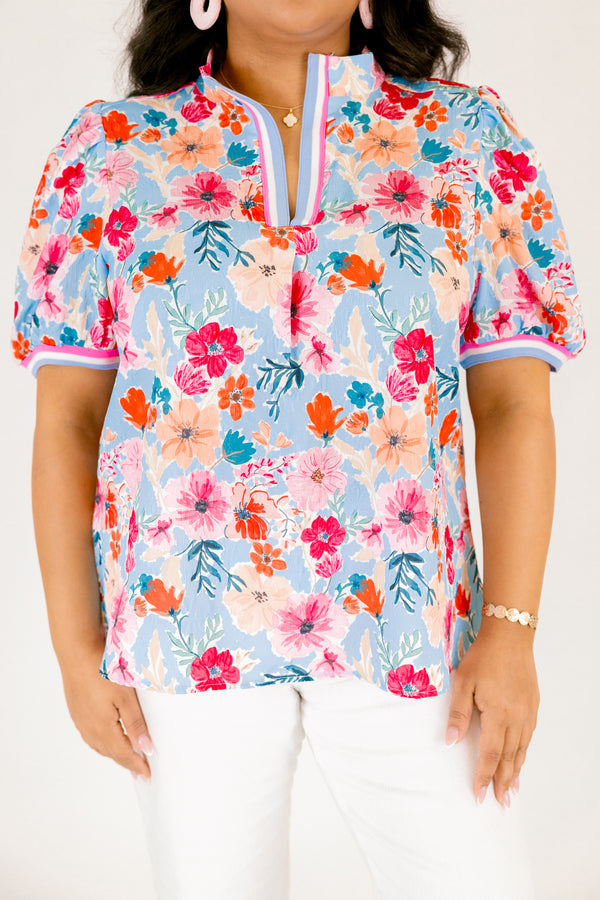 Chic Soul plus size clothing, light blue short sleeve top with pink red and orange floral design through top and blue white and pink stripe hemline along the bottom of the sleeves and bordering the v-neckline
